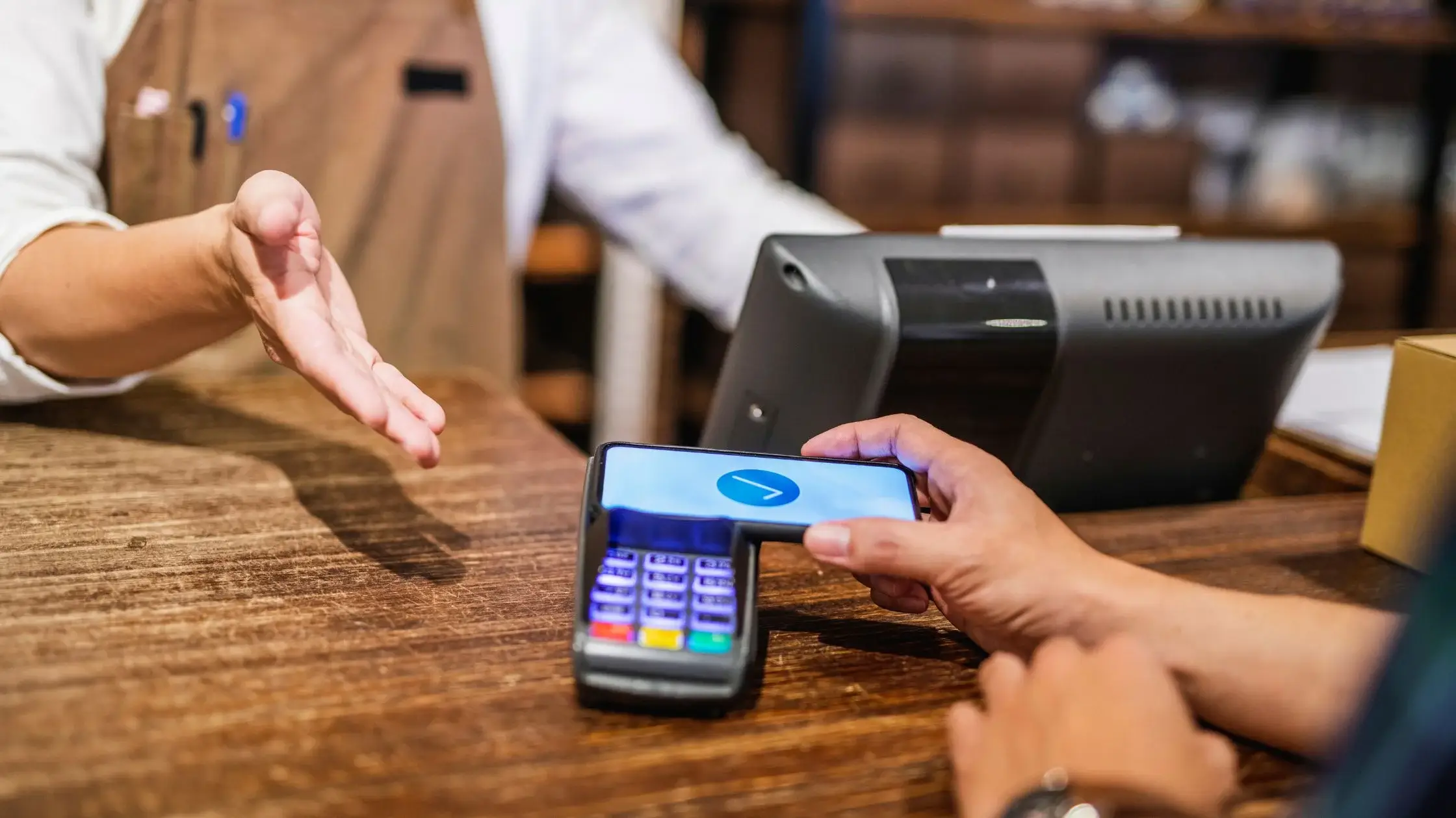 
Customer uses phone for payment on a high-risk merchant account terminal.